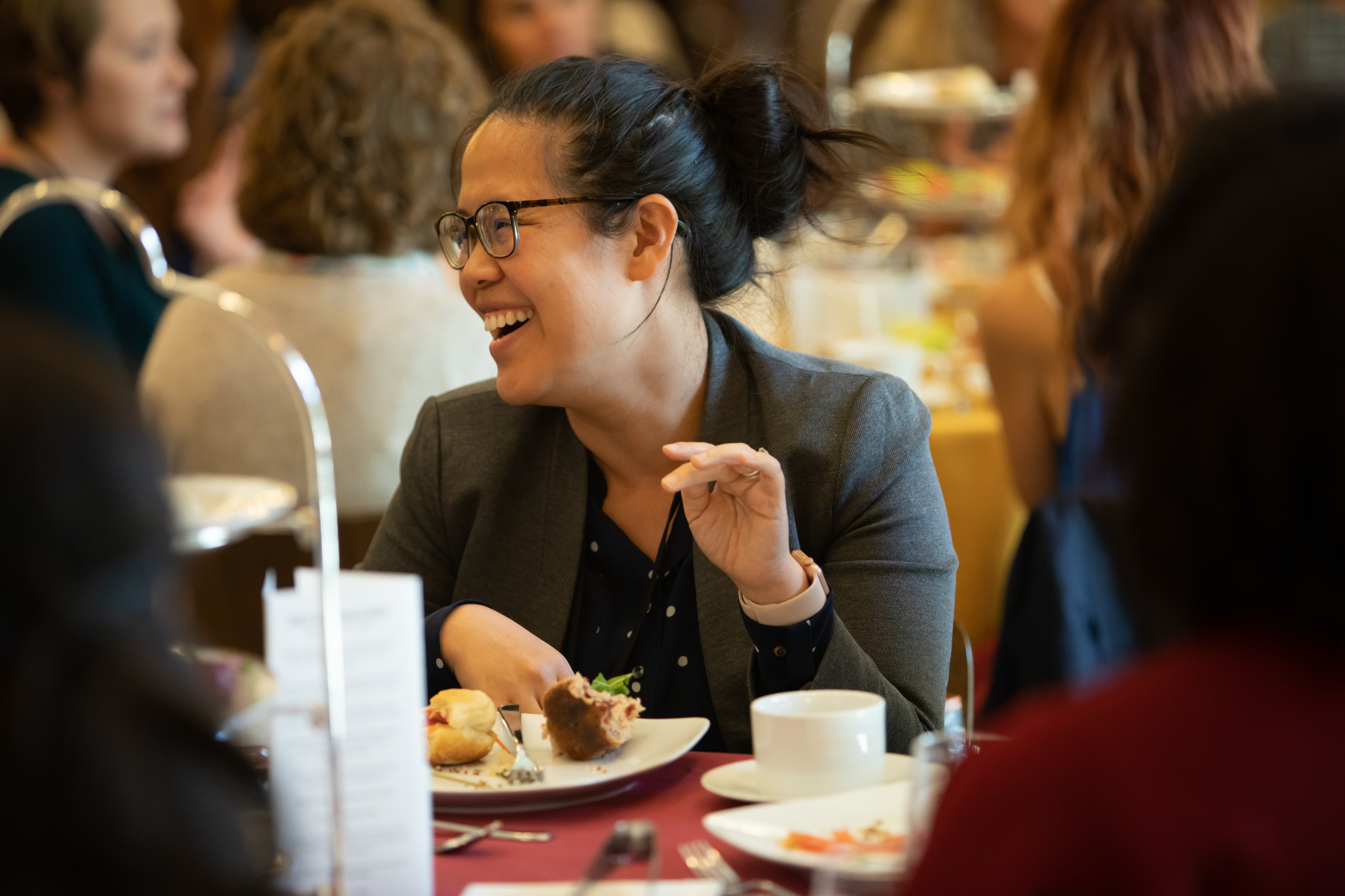 Conference attendee enjoys lunch and a laugh