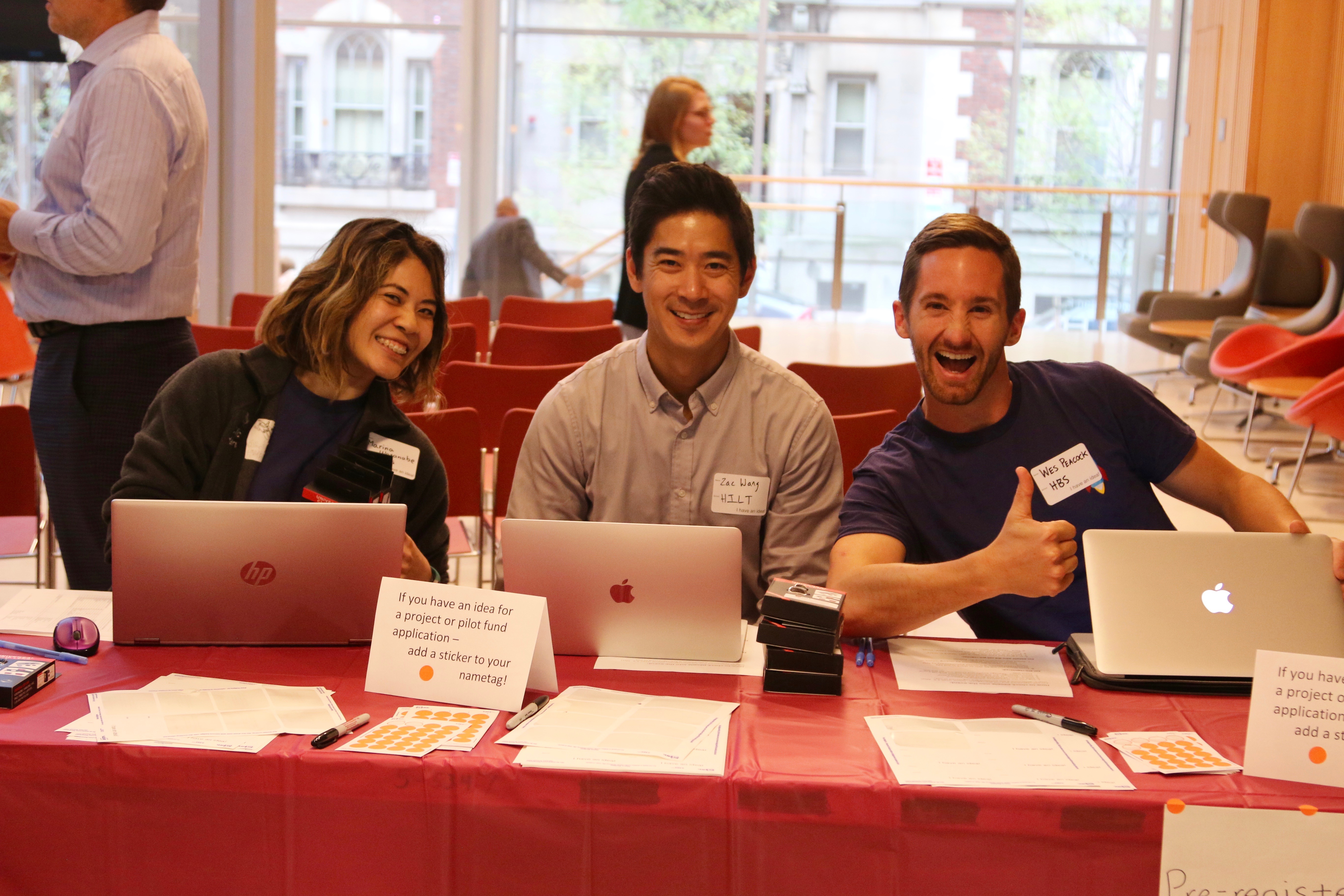 HILT Staff and SMART Fellows pose for the camera, at the registration table