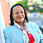 Bridget Terry Long smiling wearing a blue blazer
