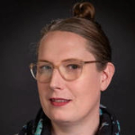 Ellen Popko smirking