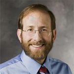 Alan Garber smiling brightly.