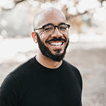 Clint Smith smiling brightly 