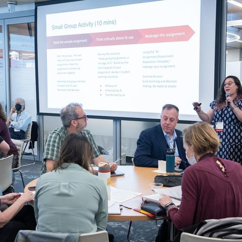 HILT 2025 Conference Attendees productively working together during a breakout session on AI. 