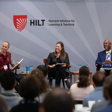 HILT 2019 Conference panel laughing during a conversation.