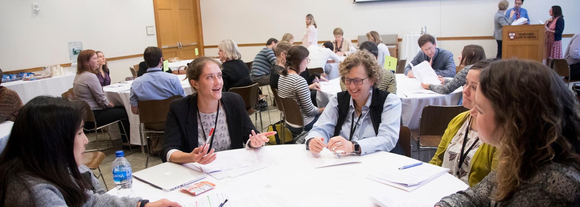 HILT 2018 Conference attendees networking at round tables.