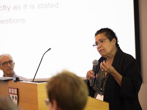 A woman speaking into a microphone