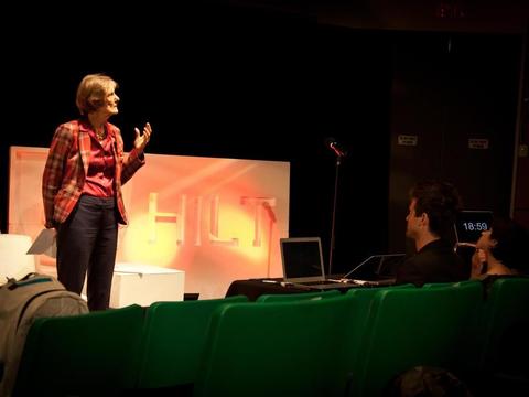 A woman standing on a decorated stage 