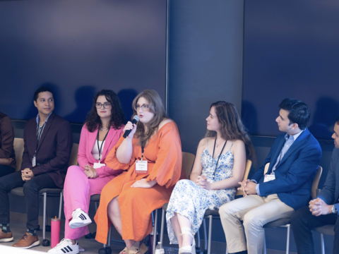 A panel of graduate school students.
