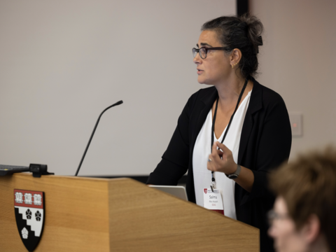 A woman speaking at a podium