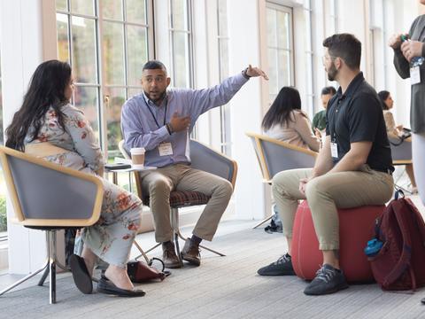 AA group of people networking during a HILT 2023 Conference