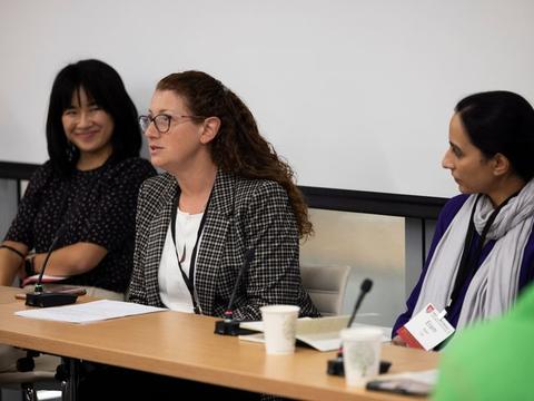 A panel of educators in a classroom