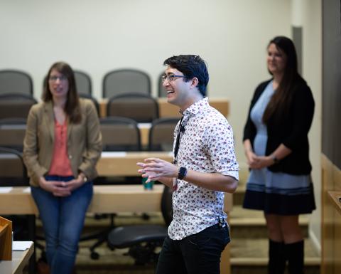 A person wearing a black and white shirt