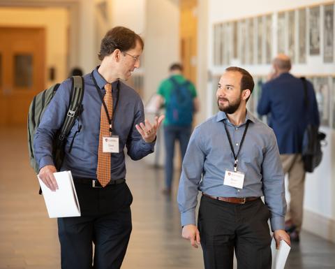 Two colleagues having a joyful conversation