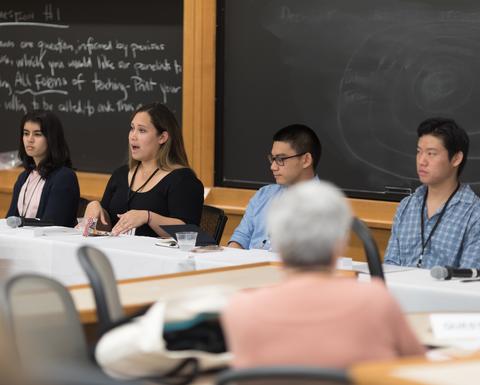 A 2017 HILT Conference panel in a Harvard classroom that has chalkboard walls.