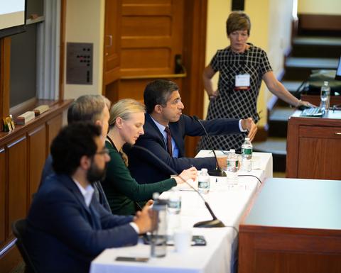 A panel of educators in a classroom