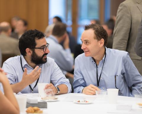 Two colleagues having a joyful conversation.