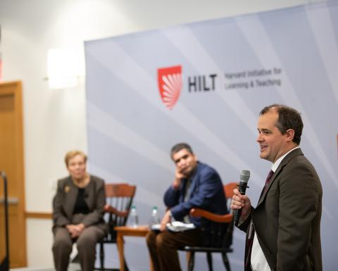 A man talking into a microphone 
