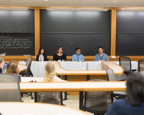 HILT 2017 Conference student panelist sitting behind a large rectangular desk.