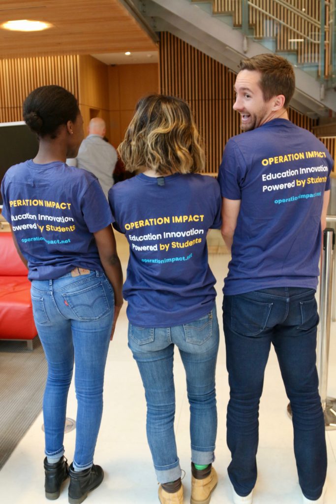Three HILT Fellows show off their operation impact shirts