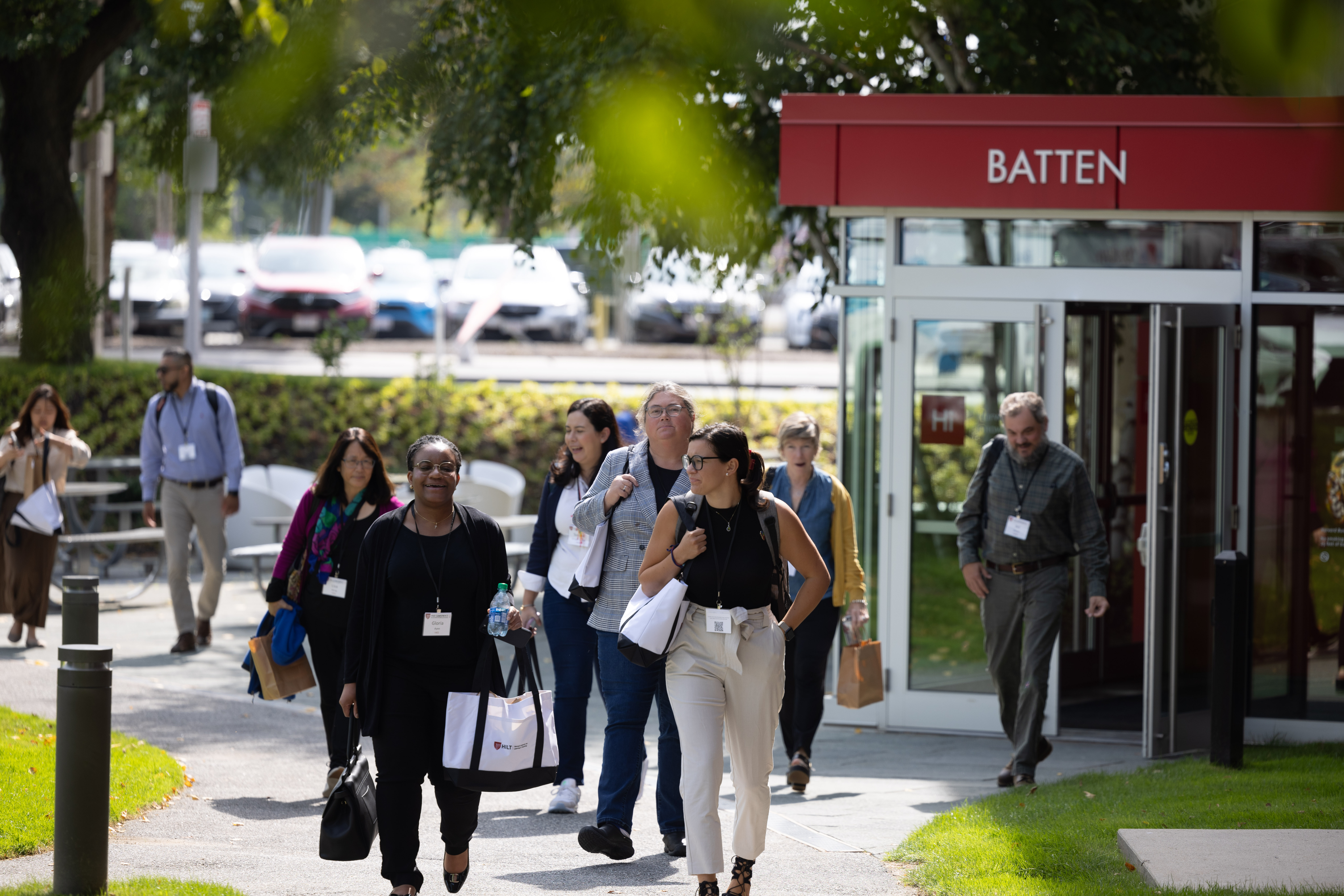Conference attendees leaving Harvard Business School's Batten Hall