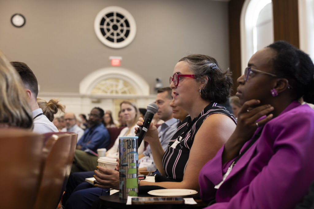 HILT Conference participant asking a question using a microphone