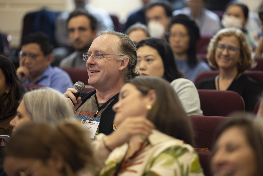 HILT Conference participant asking a question using a microphone