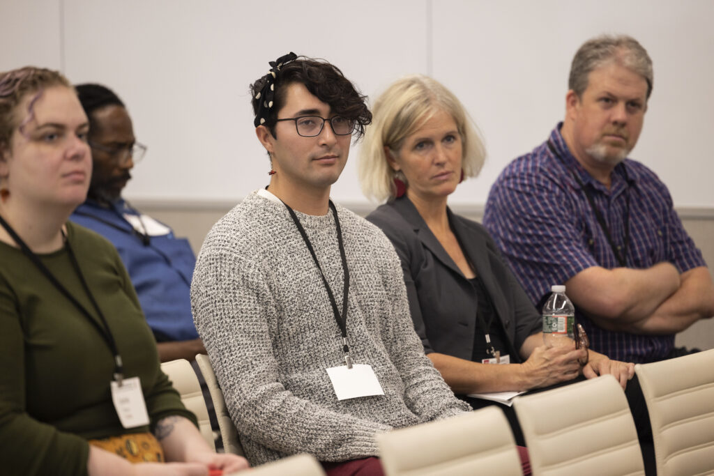 HILT Conference participants watching a presentation in a classroom