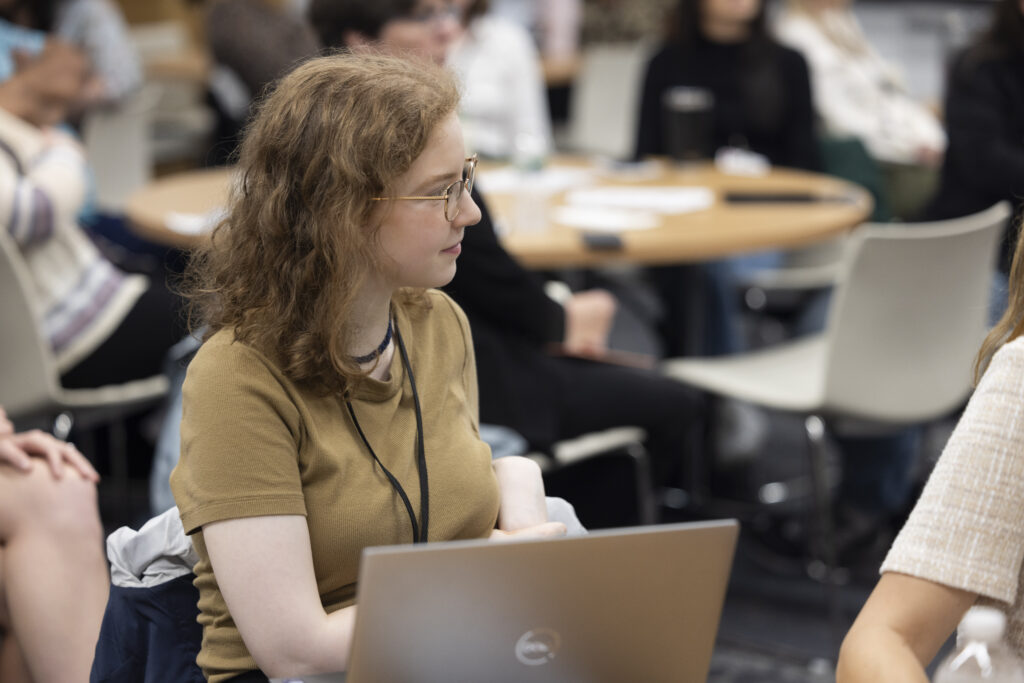 HILT Conference participant watching a presentation