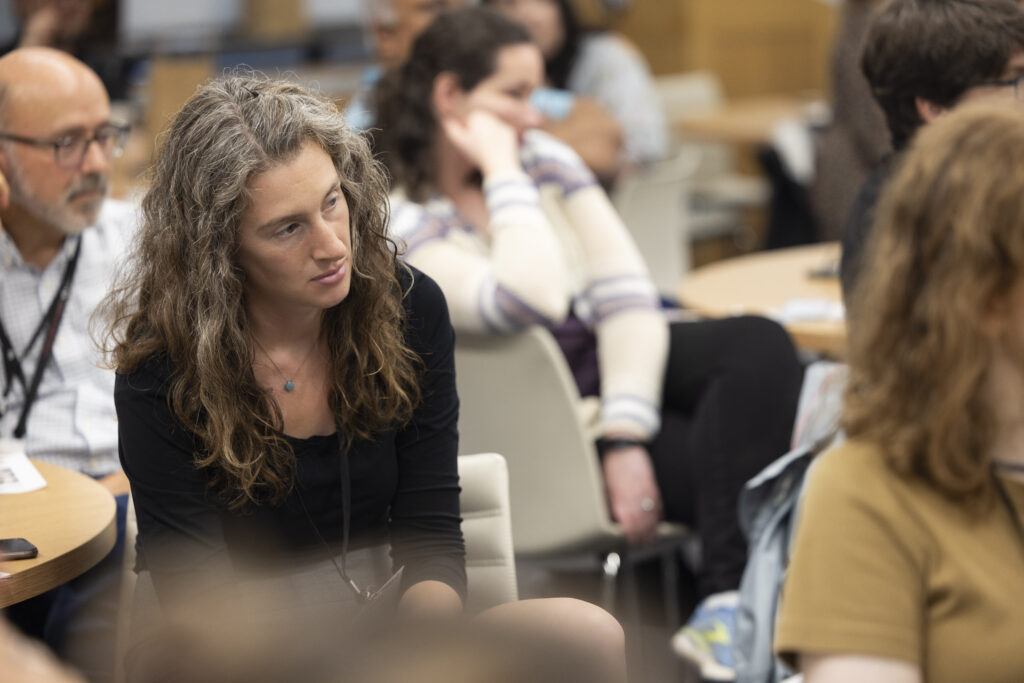 HILT Conference participant watching a presentation in a classroom