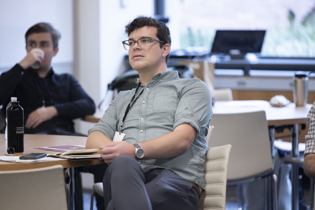 HILT Conference participant sitting on white leather chair