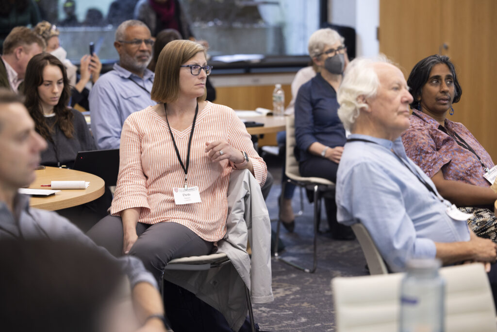 HILT Conference participants watching a presentation in a classroom