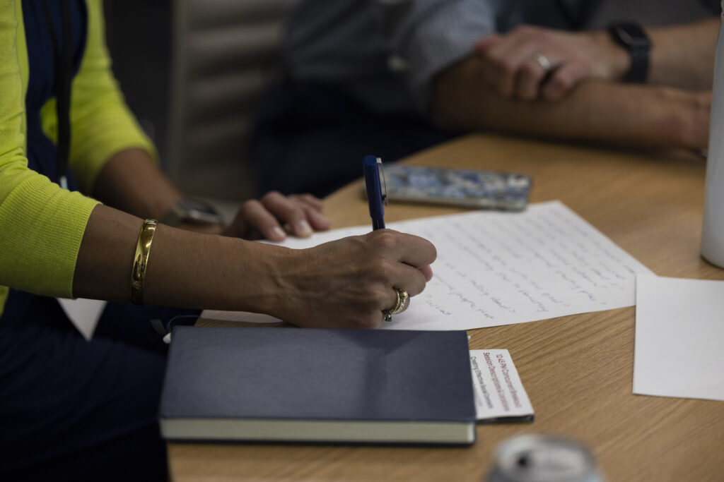 HILT Conference participant writing down notes