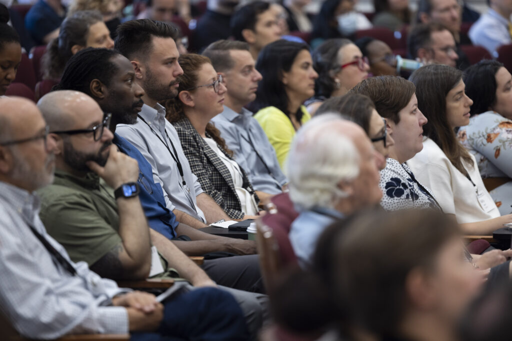 HILT Conference participants watching a presentation