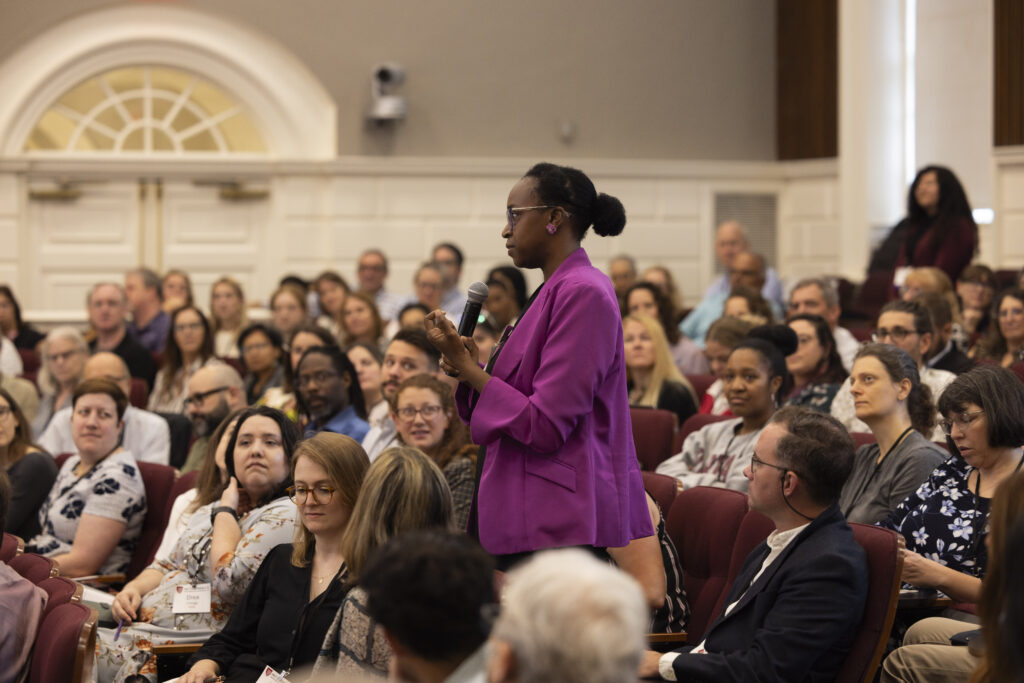 HILT Conference participant asking a question using a microphone