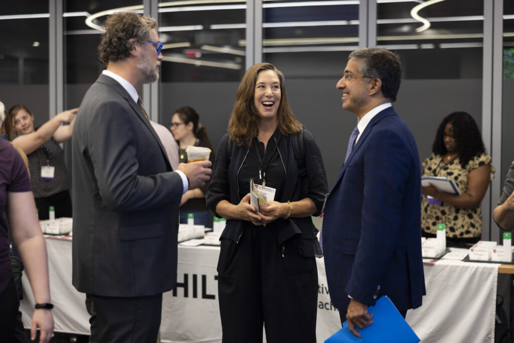 HILT Conference participants talking together in a circle