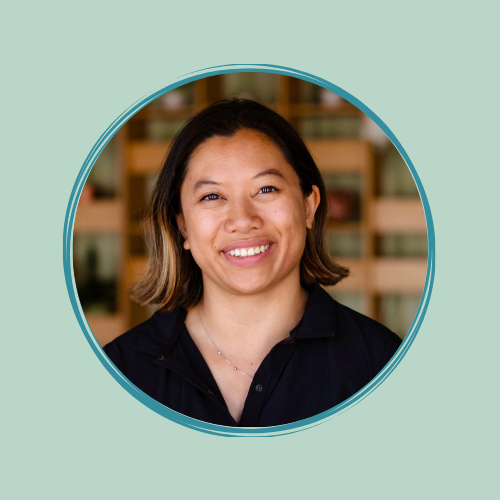 Headshot of Paulina Haduong on a light green background.